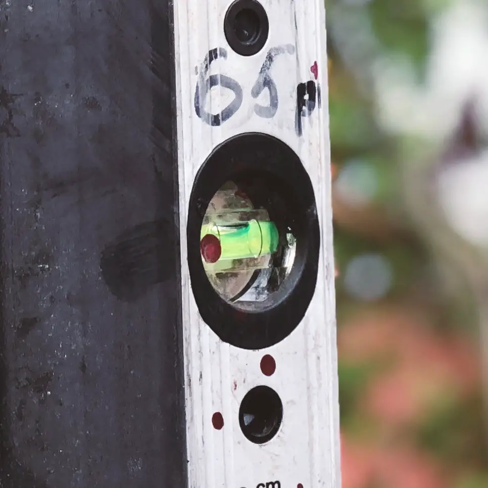 The bubble shows that the post is not plumb